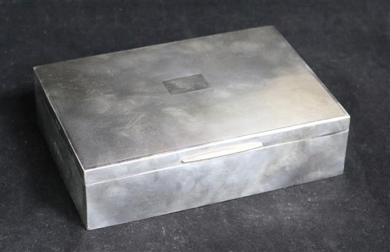 A late 1950s engine turned silver cigarette box, 17cm.